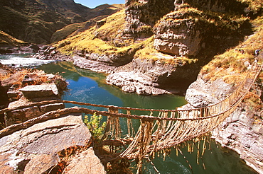 Famous Incan grass-rope suspension bridge across Apurimac River, rebuilt annually since Incan period and only one still in existence, Inca Road, Altiplano, Peru