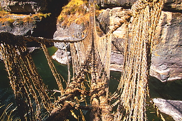 Famous Incan grass-rope suspension bridge across Apurimac River rebuilt annually since Incan period and only one still in existence, Inca Road, Altiplano, Peru