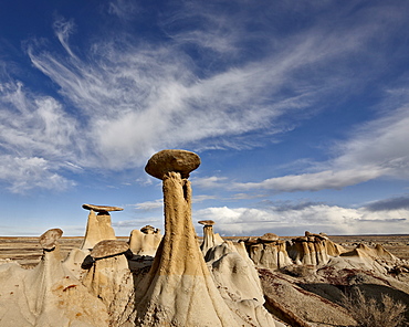 Yellow hoodoos under clouds, San Juan Basin, New Mexico, United States of America, North America