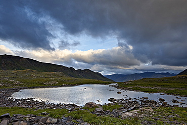 Cloudy sky above an Alpine tarn, San Juan National Forest, Colorado, United States of America, North America