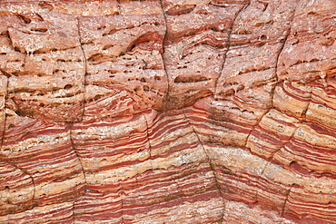 Sandstone wall with red and salmon layers and cracks, Vermillion Cliffs National Monument, Arizona, United States of America, North America 