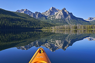 McGown Peak reflected in Stanley Lake while kayaking, Sawtooth National Recreation Area, Idaho, United States of America, North America