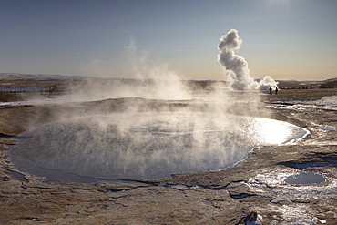 The great geyser Geysir, now dormant (2008), with the more active Strokkur geyser erupting in the distance, Geysir, Haukadalur valley, Golden Circle, Iceland, Polar Regions