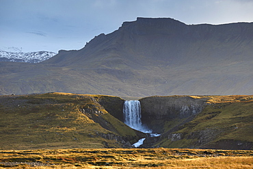 Waterfall in Snaefellsjokull National Park, Snaefellsjokull behind, covered in clouds, near Hellisandur, Snaefellsnes Peninsula, Iceland, Polar Regions