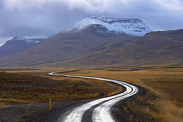 Road and landscape in Vatsnes Peninsula, with snow-covered mountains in October, north coast of Iceland, Iceland, Polar Regions