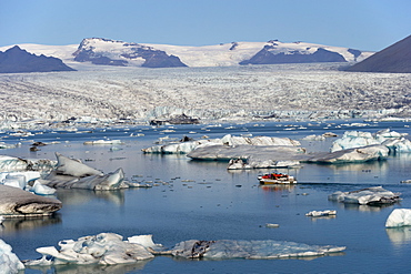 Tourist boat in Jokulsarlon glacial lagoon on a sunny morning, East Iceland, Iceland, Polar Regions