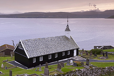 Wooden church at Nes dating from 1843, view across Tangafjordur towards Streymoy, Eysturoy Island, Faroe Islands (Faroes), Denmark, Europe