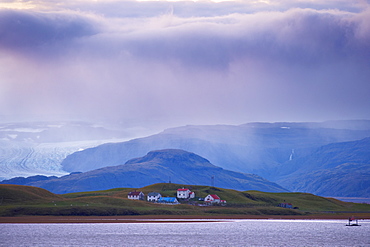 View from Hofn across Hornafjordur fjord and towards Vatnajokull1 ice cap at sunset, East Fjords region (Austurland), Iceland, Polar Regions