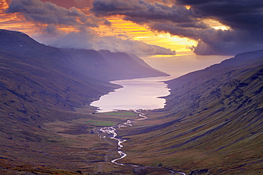 Sunset over Fjardardalur valley and Mjoifjordur fjord, East Fjords region (Austurland), Iceland, Polar Regions