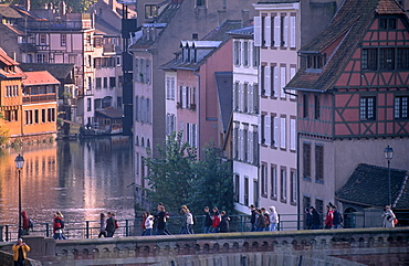 Pedestrians on the Ponts-couverts (Covered-bridges) over the River Ill, overlooking the Petite France quarter, Grande Ile, UNESCO World Heritage Site, Strasbourg, Alsace, France, Europe