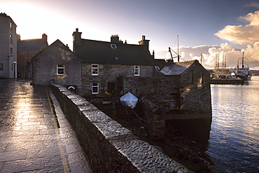 Lerwick seafront, with wharves and slipways, and stone warehouses (lodberries), Lerwick, Mainland, Shetland Islands, Scotland, United Kingdom, Europe