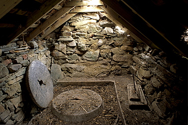 Interior of a restored old click mill alongside a small burn, used to grind grain in earlier times, Huxter, West Mainland, Shetland Islands, Scotland, United Kingdom, Europe