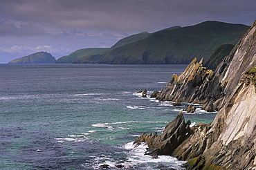 Rocky coast of Slea Head, and Blasket islands in the distance, Dingle peninsula, County Kerry, Munster, Republic of Ireland, Europe