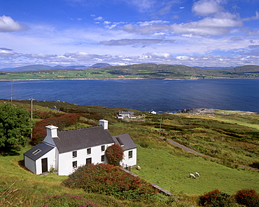 House, north coast of Mizen peninsula, Dunmanus Bay and hills of Sheep's Head behind, near Dunmanus, County Cork, Munster, Republic of Ireland, Europe