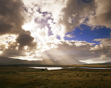 Break in the clouds over Maumturk mountains, Joyce country, Connemara, County Galway, Connacht, Republic of Ireland (Eire), Europe