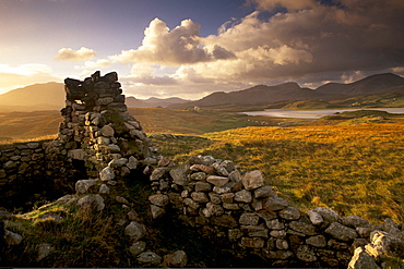 Old blackhouse ruin near Timsgarry (Timsgearraidh), west coast, sunset. Isle of Lewis, Outer Hebrides, Scotland, United Kingdom, Europe