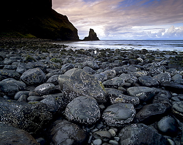 Black boulder rocks in Talisker Bay, Isle of Skye, Inner Hebrides, Scotland, United Kingdom, Europe