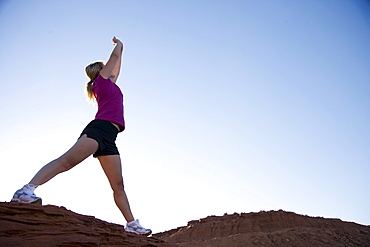 Woman exercising, Monument Valley Navajo Tribal Park, Utah Arizona border, United States of America, North America