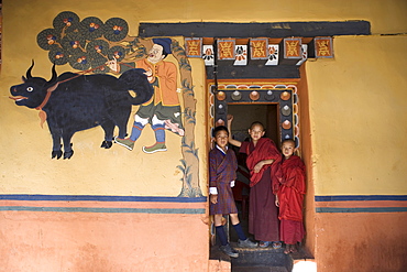 Bhutanese boy and monks, Paro Dzong, Paro, Bhutan, Asia