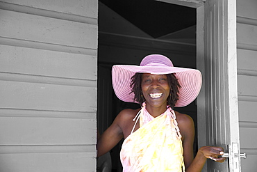 Jamaican woman in pink hat, Negril, Jamaica, West Indies, Caribbean, Central America