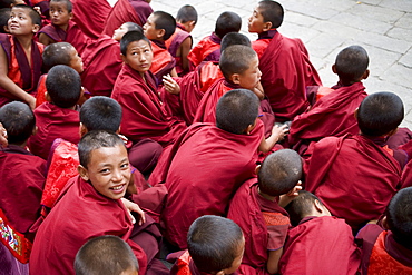 Monks watching religious dances, Buddhist festival (Tsechu), Trashi Chhoe Dzong, Thimphu, Bhutan, Asia