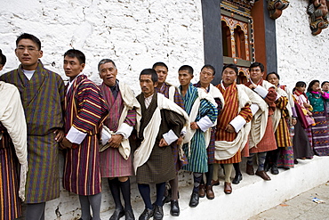 Bhutanese men in traditional dress, Buddhist festival (Tsechu), Trashi Chhoe Dzong, Thimphu, Bhutan, Asia