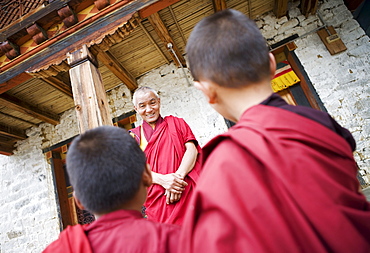 Buddhist lama teaching young monks, Karchu Dratsang Monastery, Bumthang, Bhutan, Asia