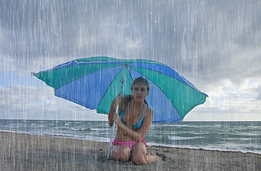 Woman on the beach in a rainy day, Florida, United States of America, North America