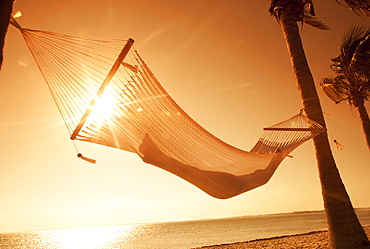 Woman in a hammock on the beach, Florida, United States of America, North America