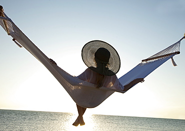 Woman on a hammock on the beach, Florida, United States of America, North America