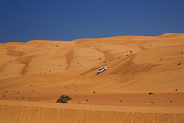 Four wheel drive on desert dunes, Wahiba, Oman, Middle East