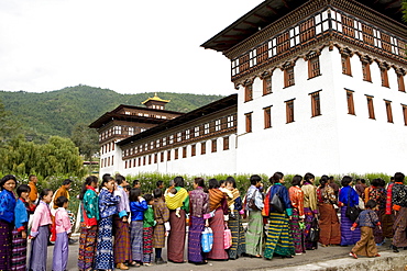 Women entering temple for Buddhist festival (Tsechu), Trashi Chhoe Dzong, Thimphu, Bhutan, Asia