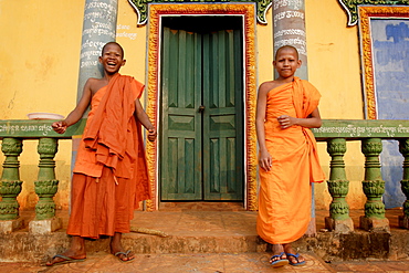 Young Buddhist novices relax outside their temple in Sen Monorom, Mondulkiri province, Cambodia, Indochina, Southeast Asia, Asia