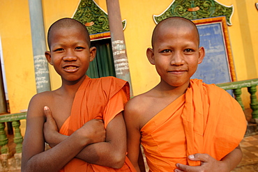 Young Buddhist novices relax outside their temple in Sen Monorom, Mondulkiri province, Cambodia, Indochina, Southeast Asia, Asia