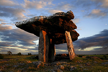 Poulnabrone dolmen megalithic tomb, Burren, County Clare, Munster, Republic of Ireland (Eire), EuropeThe Burren (from Irish: Boireann, meaning - great rock) is a unique karst landscape in northwest County Clare, Ireland. The limestone area measures 300 square kilometres and is roughly enclosed within the circle comprised by the villages Ballyvaughan, Kinvarra, Gort, Corrofin, Kilfenora, Lisdoonvarna and the Black Head lighthouse. The definitive article (ie "The" Burren) has only been added to the name by academics in the last few decades as it has always been traditionally called Boireann or Boirinn in Irish and Burren in English.
