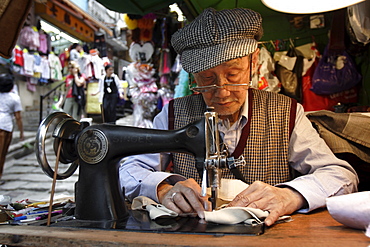 A tailor at work in Hong Kong, China, Asia