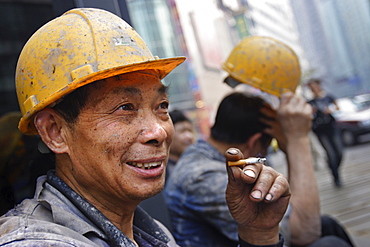 Construction workers take a cigarette break, Chongqing, China, Asia