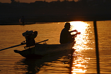 Fisherman tends his nets, Mekong river, Vientiane, Laos, Indochina, Southeast Asia, Asia