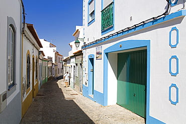 Narrow street in Ferragudo fishing village, Portimao City, Algarve, Portugal, Europe