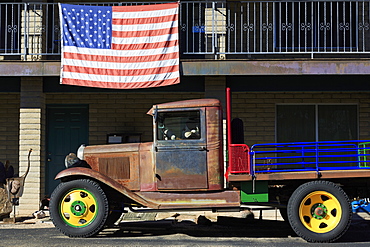 Old truck and American flag, Cave Creek, Arizona, United States of America, North America