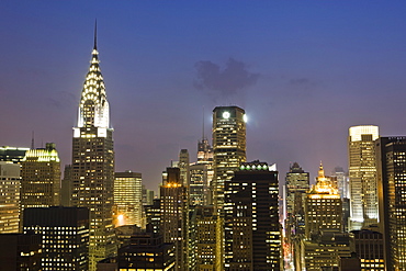 City skyline including the Chrysler Building at dusk, Manhattan, New York, United States of America, North America