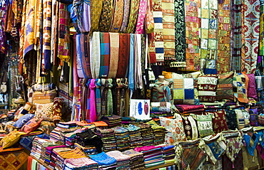 Fabrics, rugs, scarves, cushions for sale, Grand Bazaar (Great Bazaar), Istanbul, Turkey, Europe