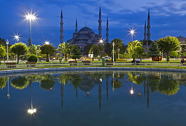 Blue Mosque in evening, reflected in pond, Sultanahmet Square, Istanbul, Turkey, Europe