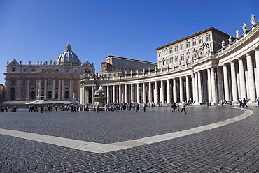 St. Peter's basilica and curved row of columns in Piazza San Pietro, Vatican City, Rome, Lazio, Italy, Europe