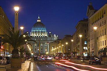 St. Peter's Basilica illuminated at night with moving traffic, Vatican City, Rome, Lazio, Italy, Europe