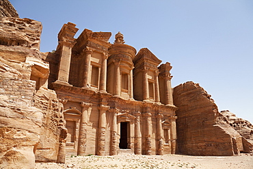 The facade of the Monastery carved into the red rock at Petra, UNESCO World Heritage Site, Jordan, Middle East