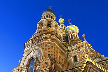 Looking up at the Church on Spilled Blood illuminated at dusk, UNESCO World Heritage Site, St. Petersburg, Russia, Europe