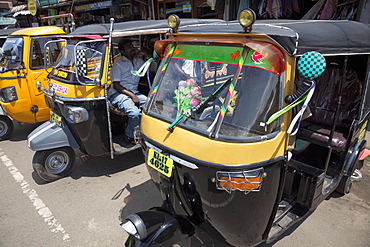 Auto rickshaws for hire in the street in Munnar, Kerala, India, Asia 