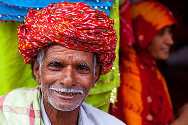 Old man in traditional turban outside a shop in Deogarh, Rajasthan, India, Asia