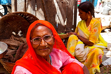 Two ladies in traditional dress in a street market in the city of Udaipur, Rajasthan, India, Asia